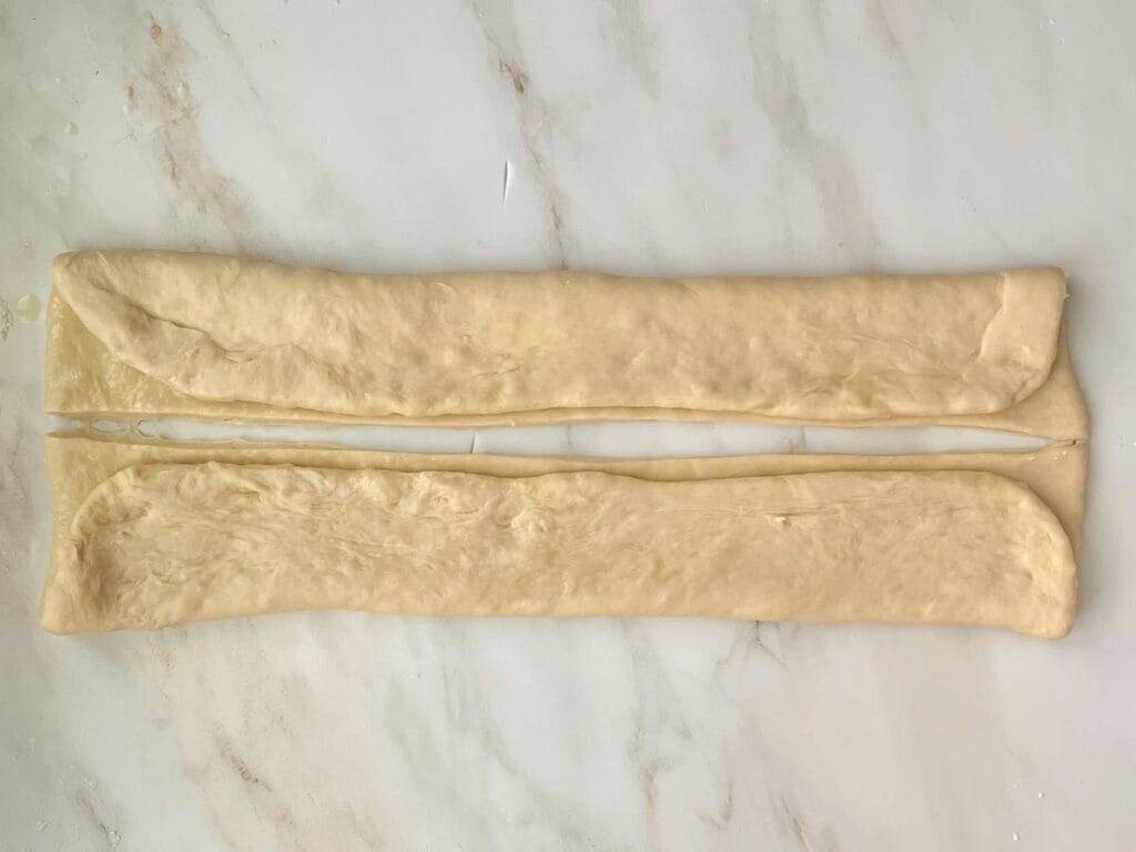 Parker House Rolls dough folded in half.