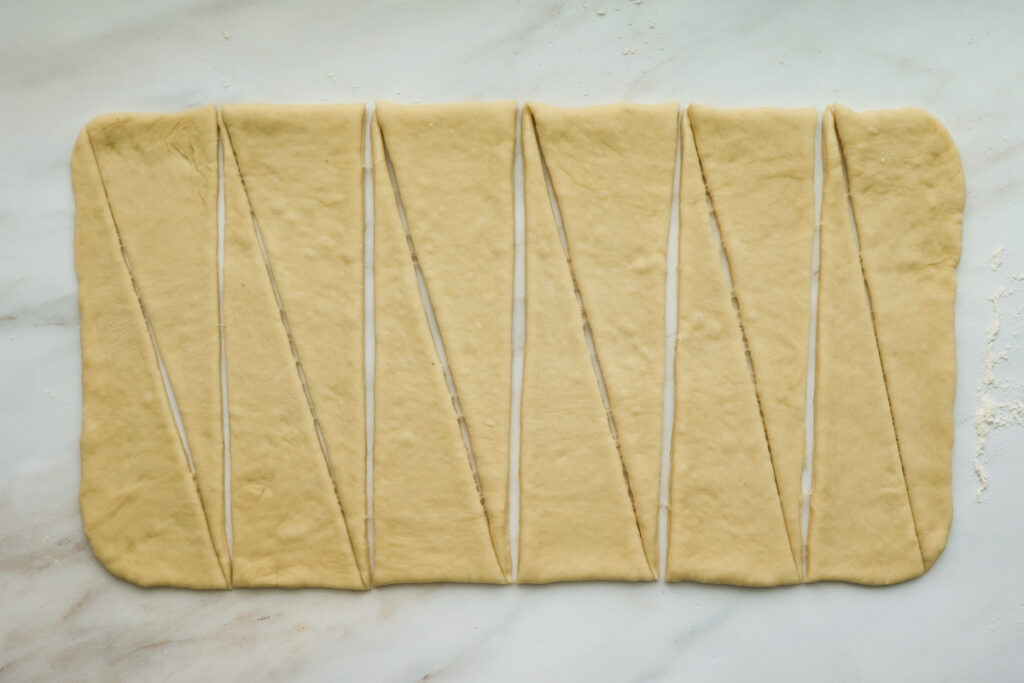 Roll dough rolled out to a rectangle, cut into 12 triangles.