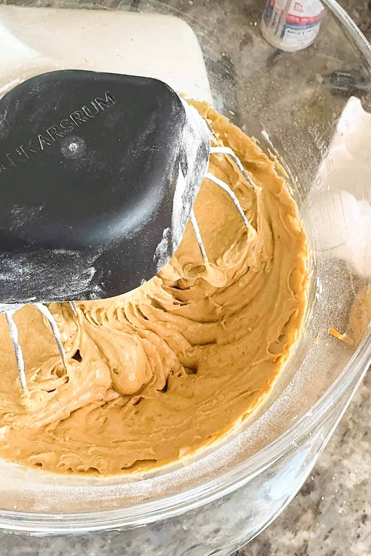 The spiced gingerbread batter, all mixed together inside a mixer bowl.