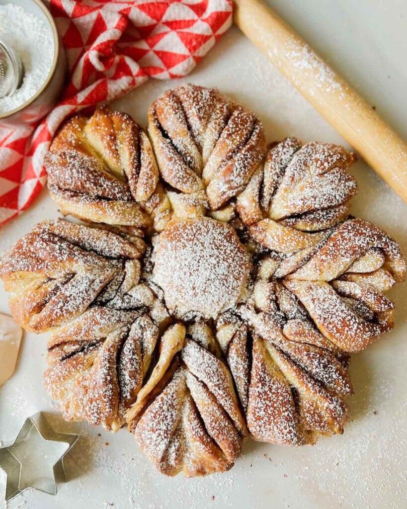 A Star Bread with powdered sugar sprinkled on top and a title that says Holiday recipes.