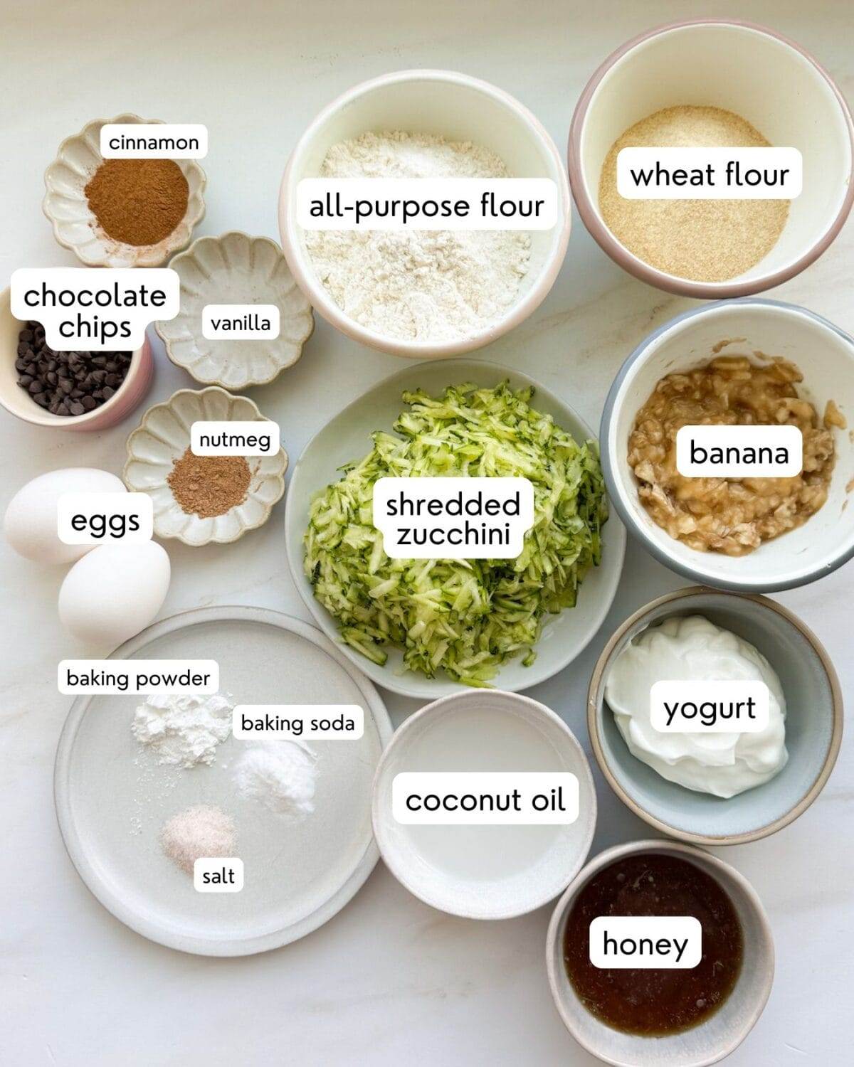 All the ingredients for zucchini muffins with chocolate chips measured and on the counter.